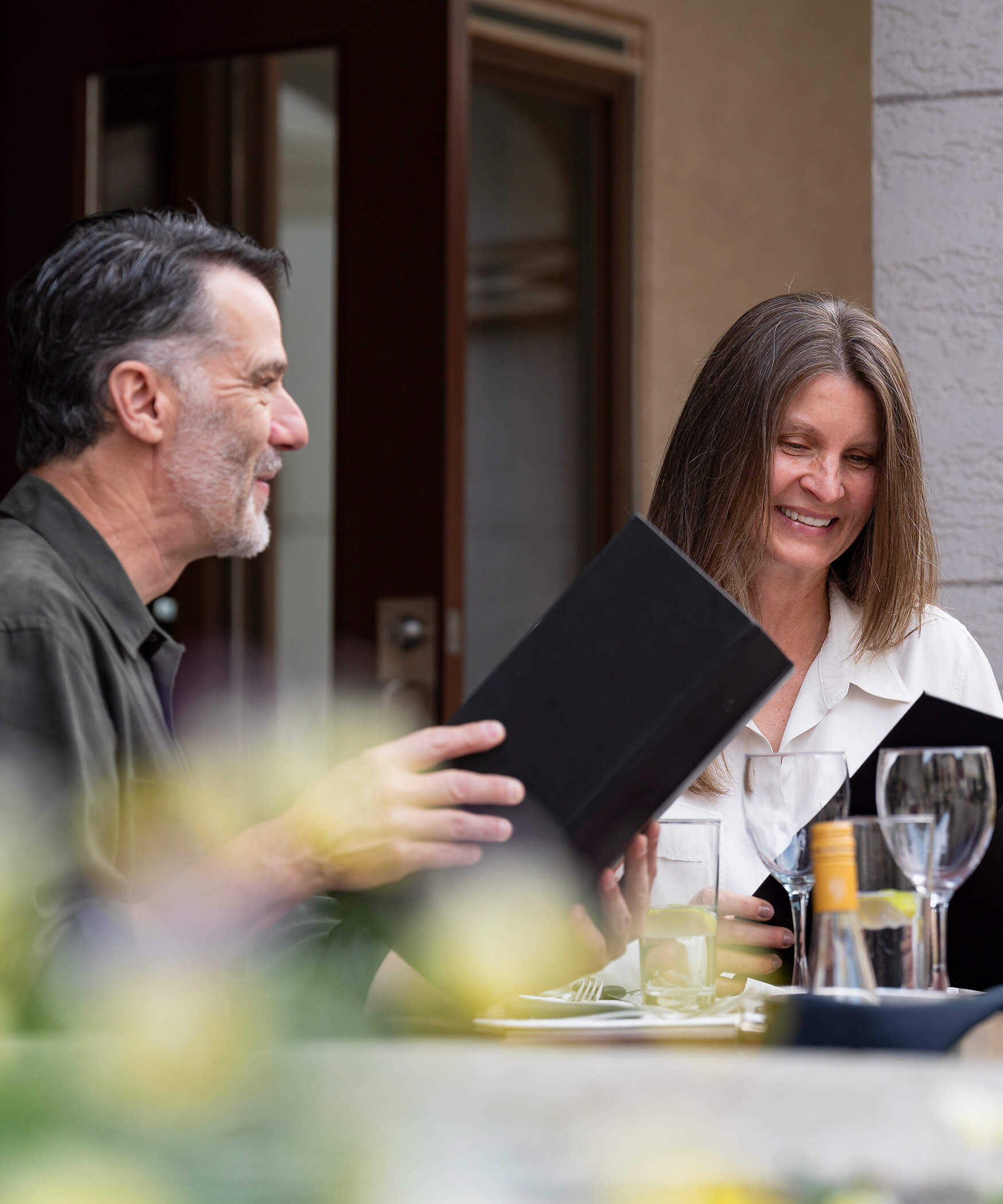 A woman and a man eating at the steakhouse