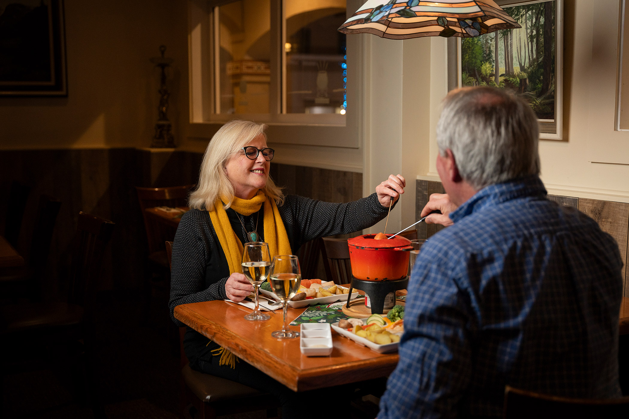 Two guests eating in the Fondue Stube