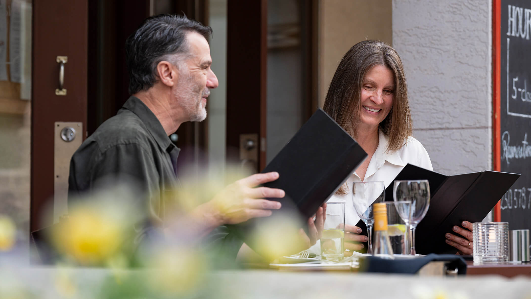 A woman and a man eating at the steakhouse