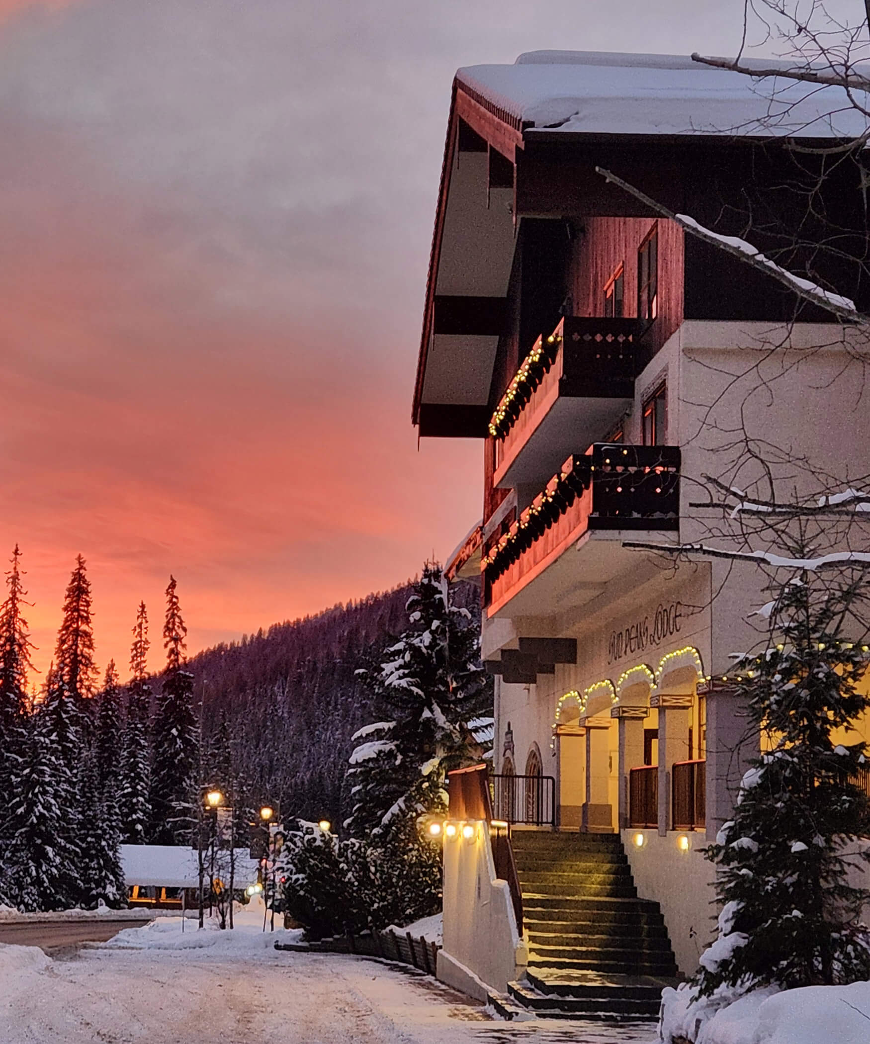 Exterior facade of the Sun Peaks Lodge at sunset